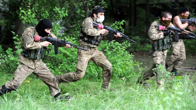 Pro-Russian armed militants of a so-called "Eastern battalion" take part in military exercises in the forest near the eastern Ukrainian city of Donetsk 