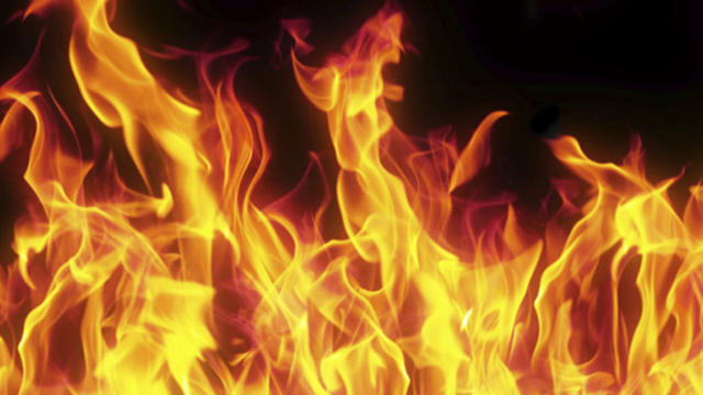 Close-Up Of Fire Against Black Background 
