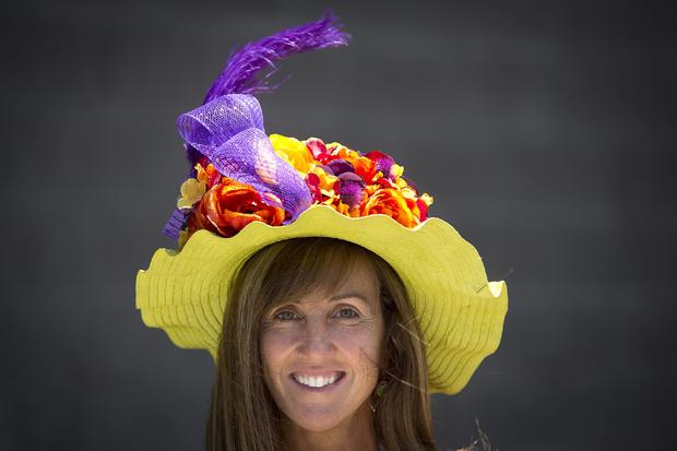 Debbie Guseman poses for a portrait with her colorful hat before the 146th running of the 2014 Belmont Stakes in Elmont, New York, June 7, 2014. 
