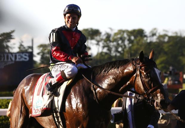Jockey Joel Rosario, in the irons on Tonalist, smiles after winning the 146th running of the Belmont Stakes at Belmont Park in Elmont, New York, June 7, 2014. 