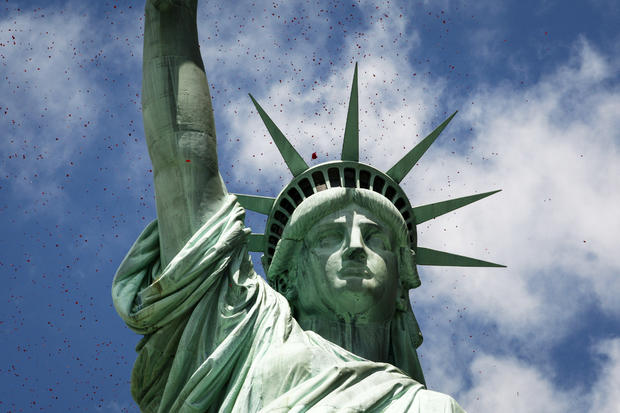 Million Rose Pedals Dropped Over Statue Of Liberty Commemorating 70th Anniversary Of D-Day 