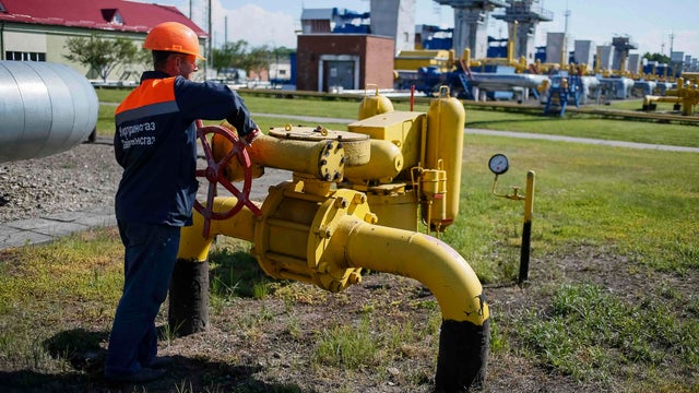 A worker turns a valve at an underground gas storage facility near Striy in western Ukraine 