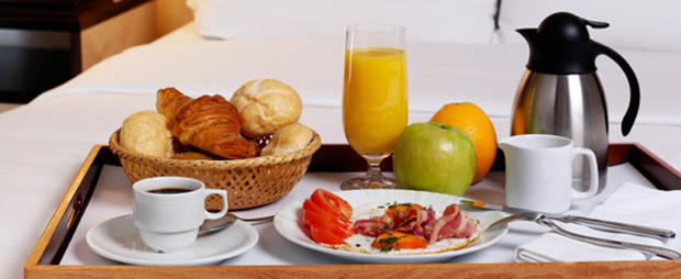 breakfast bed orange juice coffee header 610 fruit 
