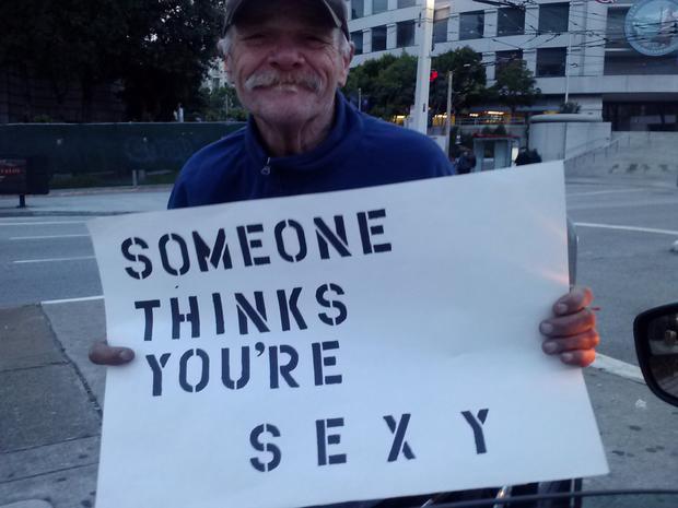 Homeless  Hold Clever Donation Signs Made For  Them 