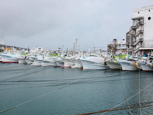 Fishing boats are moored at Tomari port in Naha, on Japan's southern island of Okinawa, as Typhoon Neoguri approaches the region 