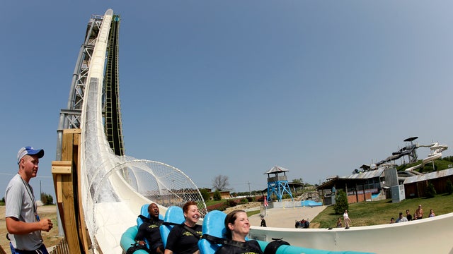 Riders go down the world's tallest waterslide, called "Verruckt," at Schlitterbahn Waterpark July 9, 2014, in Kansas City, Kan., in this picture taken with a fisheye lens. 