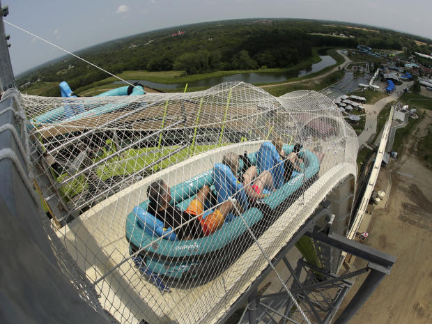 Riders go down the world's tallest waterslide, called "Verruckt," at Schlitterbahn Waterpark July 9, 2014, in Kansas City, Kan., in this picture taken with the fisheye lens. 