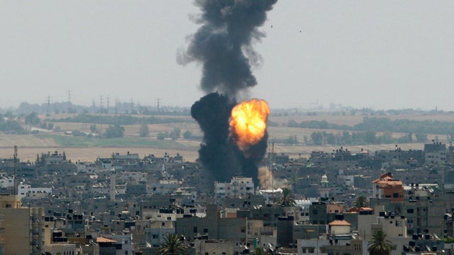 Smoke and flames rise following what witnesses said was an Israeli airstrike in Gaza City 