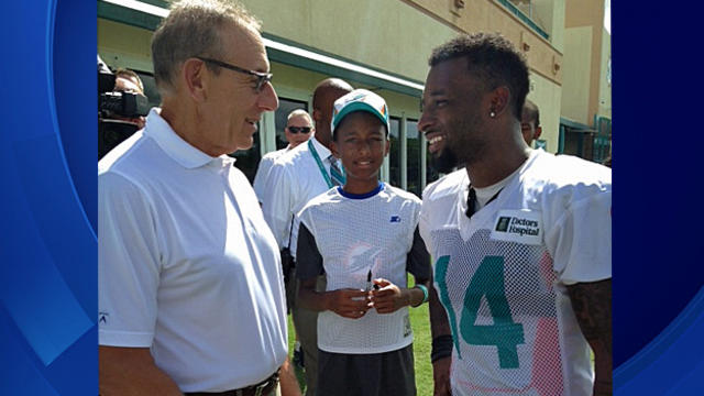ross-and-player-miami-dolphins-camp-day-1.jpg 