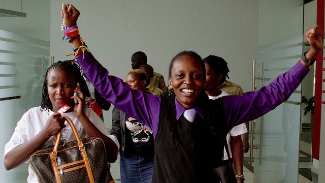 Members of Uganda's gay community and gay-rights activists react as the constitutional court overturns anti-gay laws in Kampala Aug. 1, 2014. 