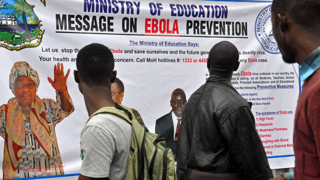 The image of Liberia President Ellen Johnson Sirleaf appears on a banner warning people about the Ebola virus in the city of Monrovia, Liberia, Aug. 8, 2014. 