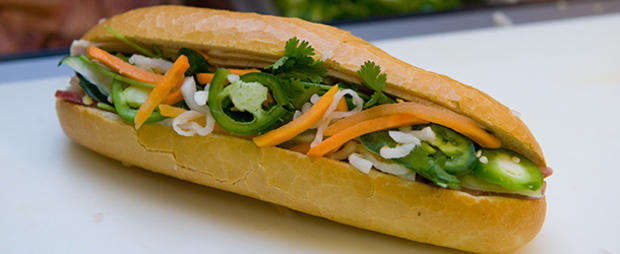 A banh mi sandwich sits prepared for eat 610 header vietnamese 