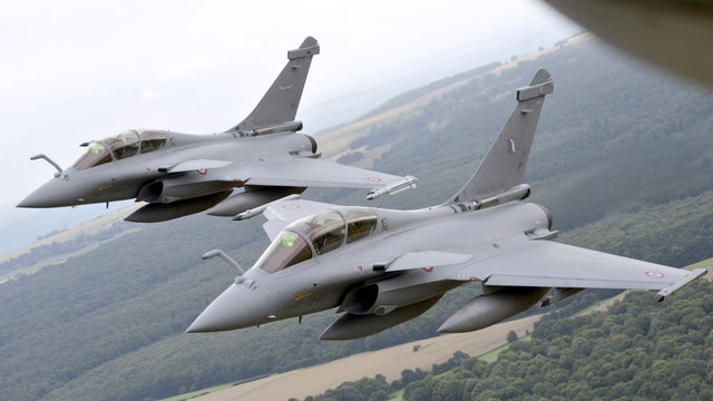 Two French Rafale fighter planes fly outside Paris  