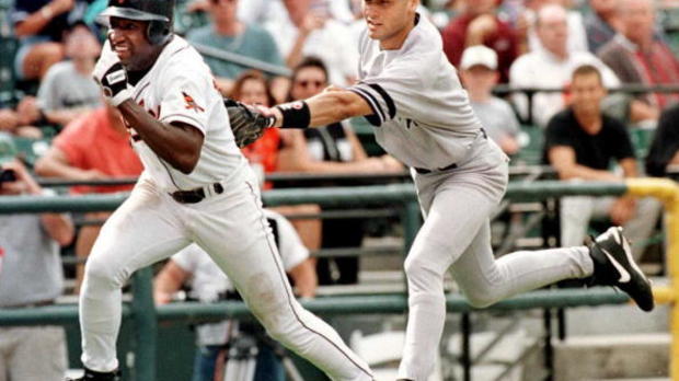 New York Yankees shortstop Derek Jeter (R) tags ou 
