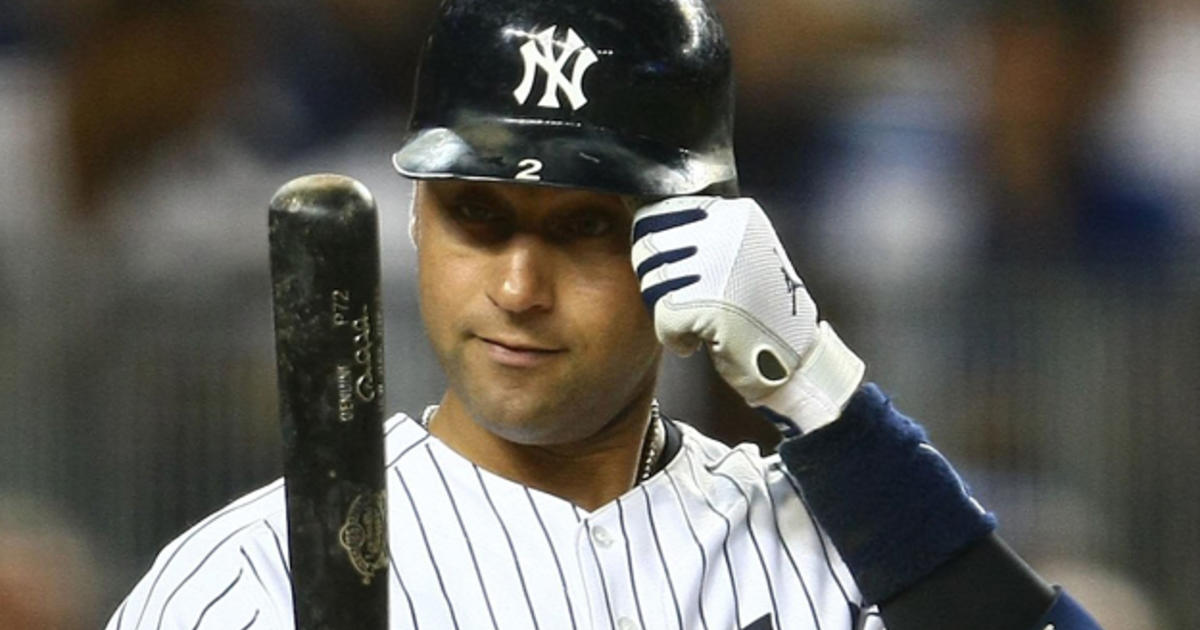 United States captain Derek Jeter reacts after being hit by a ball