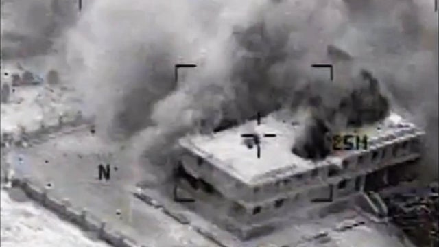 a structure in Tall Al Qitar, Syria moments after a U.S. airstrike 