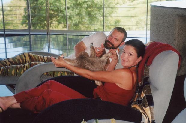 John and Ann Bender with a pet sloth 
