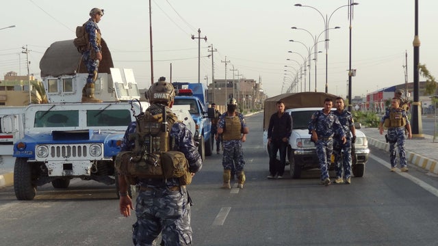 Iraqi security forces man a checkpoint in the northern city of Kirkuk 