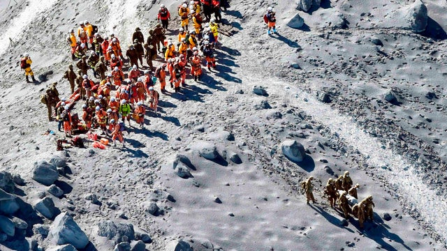 Japan Self-Defense Force (JSDF) soldiers and firefighters conduct rescue operations near the peak of Mt. Ontake 