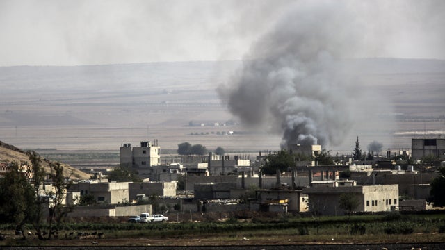Smoke rises from the Syrian town of Kobani, seen from near the Mursitpinar border crossing on the Turkish-Syrian border 