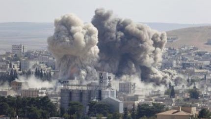 Smoke rises after an U.S.-led air strike in the Syrian town of Kobani Oct 8, 2014.  