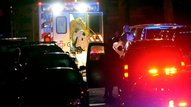 Ebola patient Amber Vinson steps from an ambulance at Emory University Hospital 