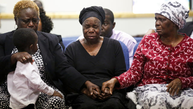 Garteh Korkoryah, center, mother of Thomas Eric Duncan, is comforted during a memorial service for her son Oct. 18, 2014, in Salisbury, N.C. Duncan died of Ebola in Dallas on Oct. 8. 