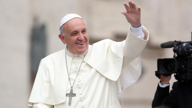 Pope Francis waves to the faithful during his weekly audience in St. Peter's Square Oct. 15, 2014, in Vatican City. 