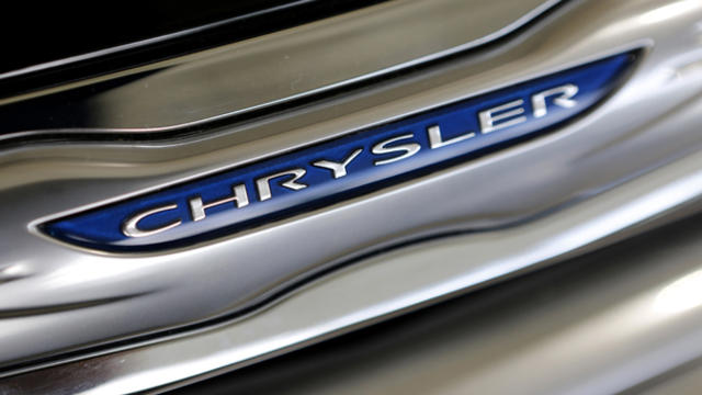 The Chrysler logo is seen on a new Chrysler 200 in the showroom at the Massey-Yardley Chrysler, Dodge, Jeep and Ram automobile dealership in Plantation, Florida, Oct. 8, 2013. 
