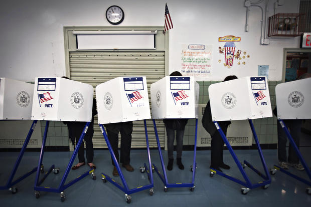 Voters fill in their ballots at a polling station in the Upper East Side of New York November 4, 2014. American voters will decide which party controls the U.S. Senate in Tuesday's elections, and at least 10 competitive races are still considered too clos 