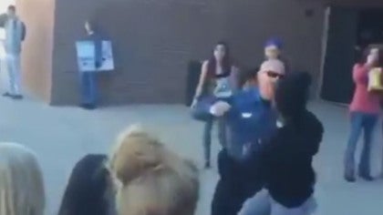 officer-hitting-student.jpg 