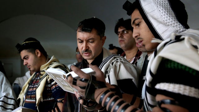 Iranian Jewish men pray at the Molla Agha Baba Synagogue, in the city of Yazd 420 miles (676 kilometers) south of capital Tehran, Iran 