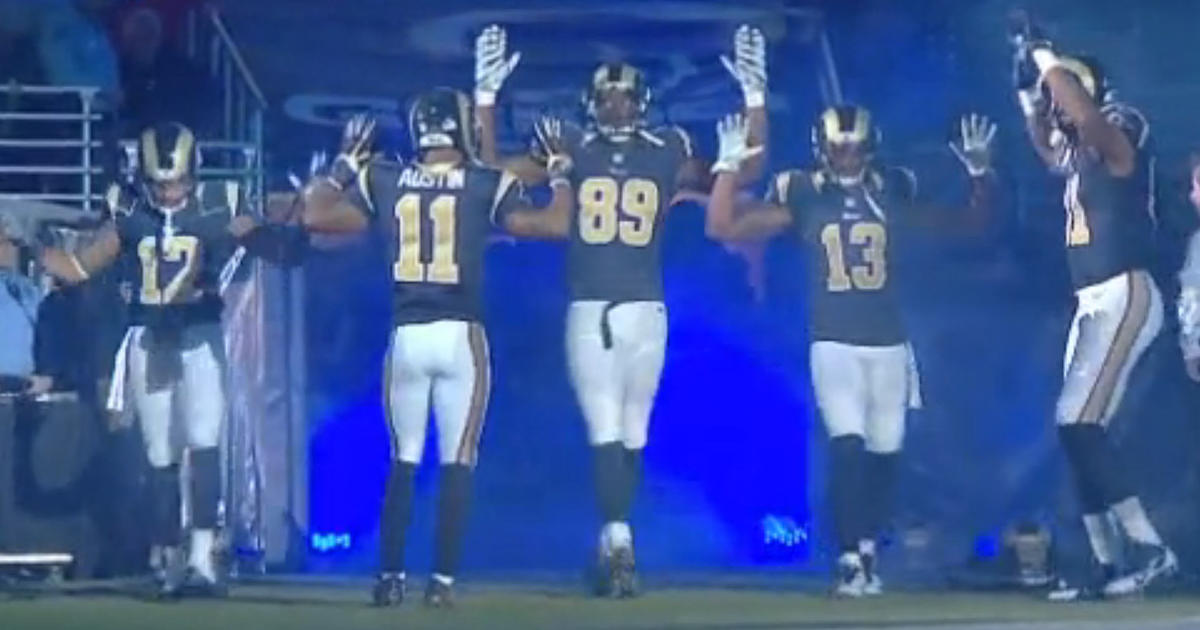 St Louis Rams players raise hands in apparent Ferguson gesture