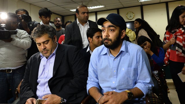 Indian Uber Cabs General Manager for Delhi Gagan Bhatia (right) meets with the members of the Delhi Woman Commission in New Delhi 