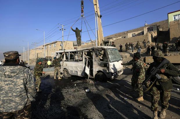 Afghan National Army soldiers (ANA) inspect the site of a suicide attack in Kabul 