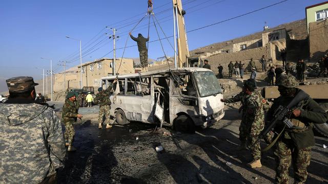 Afghan National Army soldiers (ANA) inspect the site of a suicide attack in Kabul 