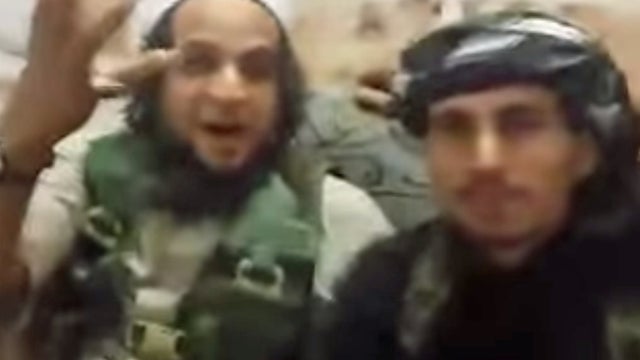 ISIS militants gather for "slave market" 