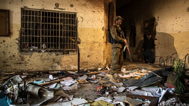 Soldier stands inside Army Public School, which was attacked by Taliban gunmen, in Peshawar, on December 17, 2014 