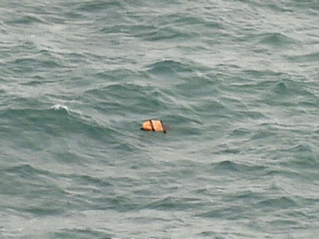 Aerial view taken from Indonesian search and rescue aircraft over Java Sea shows floating debris spotted in same area as other items being investigated by Indonesian authorities as possible objects from missing AirAsia Flight 8501 on December 30, 2014 
