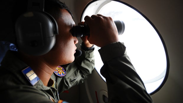 Indonesian navy personnel prepare for departure for the rescue operation of AirAsia Flight 8501 at Indonesian Naval Aviation Base Juanda Jan. 3, 2015, in Surabaya, Indonesia. 