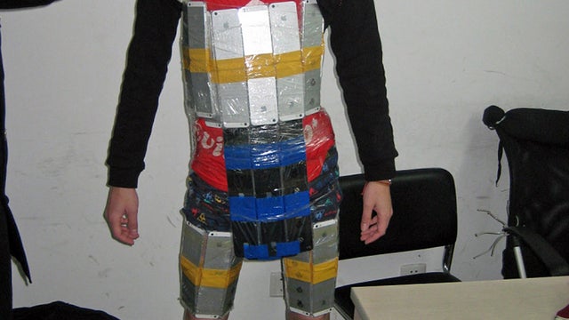 ​A man arrested by Chinese customs officials at a checkpoint in Shenzhen 