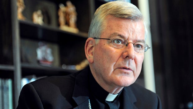 St. Paul and Minneapolis Archbishop John Nienstedt talks with a reporter at his office in St. Paul, Minn., July 30, 2014.
