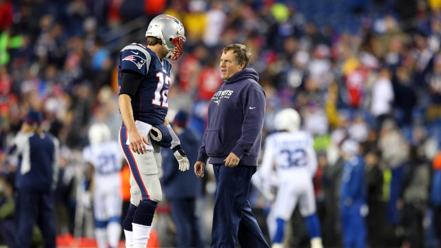 New England Patriots quarterback Tom Brady talks with head coach Bill Belichick before the AFC championship game against the Indianapolis Colts at Gillette Stadium Jan. 18, 2015, in Foxboro, Massachusetts. 