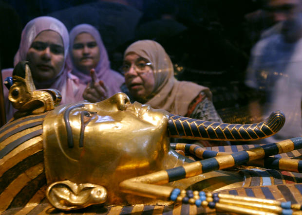 Women look at one of the coffins of King Tutankhamun at the Egyptian museum in Cairo 