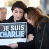 People hold a sign reading ''I am Charlie'' after observing a minute of silence in the old Harbor in Marseille 