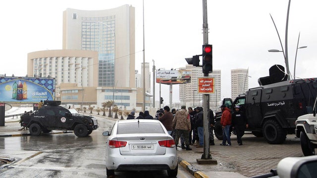 Security forces surround the Corinthia Hotel after a car bomb in Tripoli, Libya 