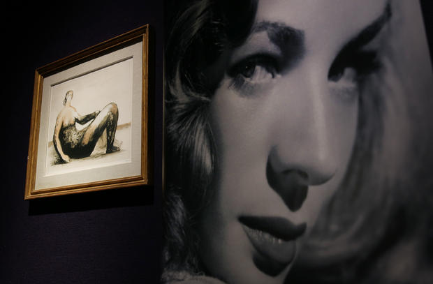 A photograph of Lauren Bacall sits beside a Henry Moore lithograph at Bonhams auctioneers in London, England, Feb. 13, 2015. 