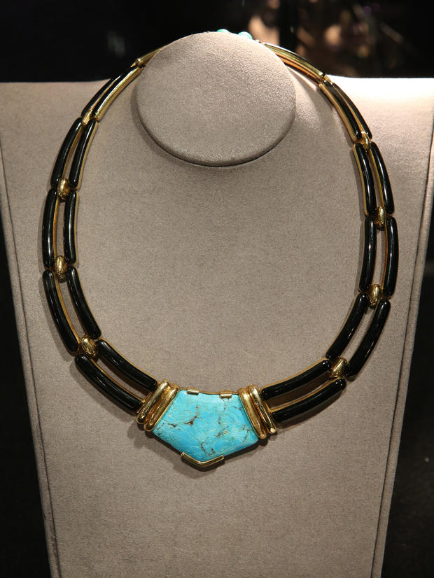 A turquoise enamel and 18-karat gold necklace belonging to Lauren Bacall are displayed at Bonhams auctioneers in London, England, Feb. 13, 2015. 