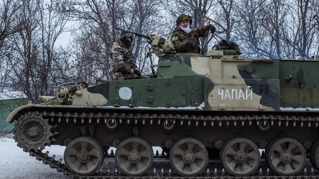 Ukrainian soldiers prepare to drive in the direction of the embattled town of Debaltseve 