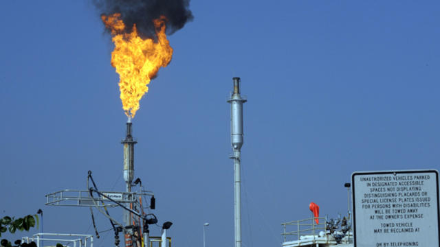 Flames leap from a burner unit after an explosion at the Exxon-Mobil refinery in Torrance, California, Feb. 18, 2015. 